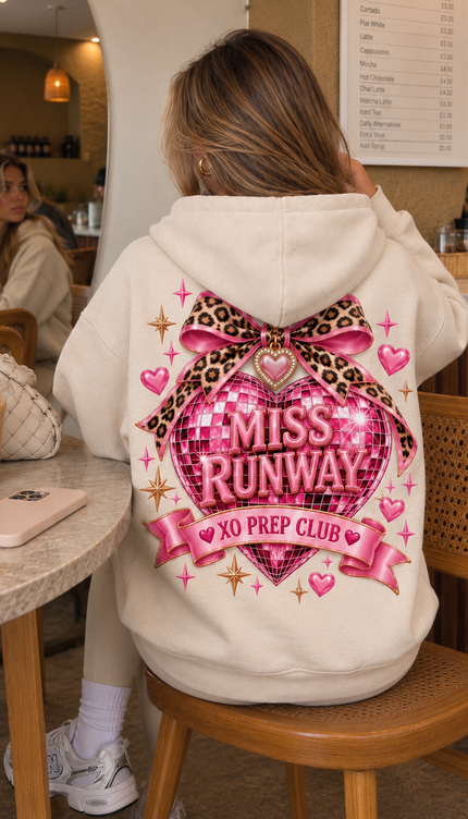Back of the Miss Runway Prep Club kids' hoodie in cream with a pink disco heart, leopard print bow and XO Prep Club banner