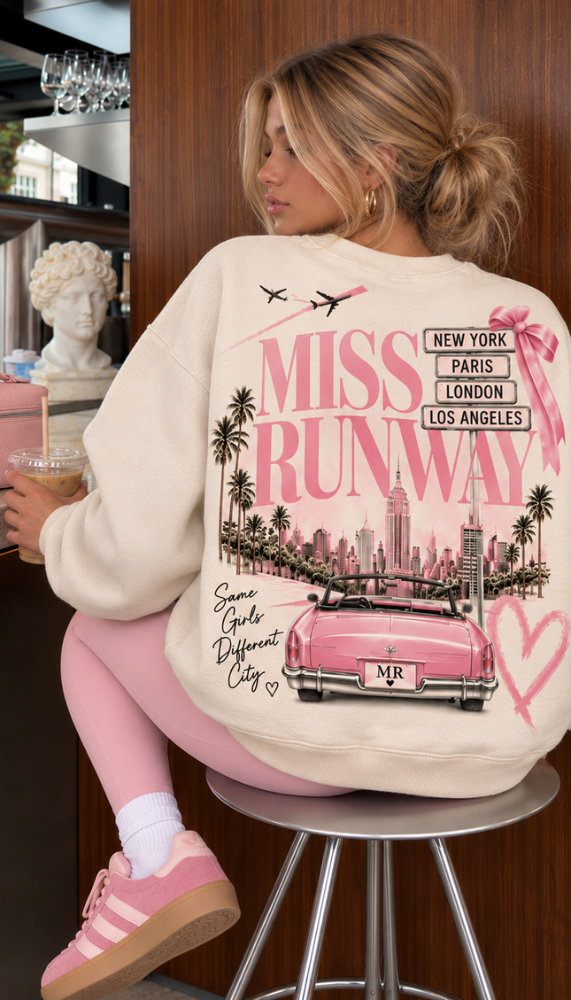 Back of the Miss Runway World Tour kids' sweatshirt in cream with a pink city skyline, convertible car and Same Girls Different City print