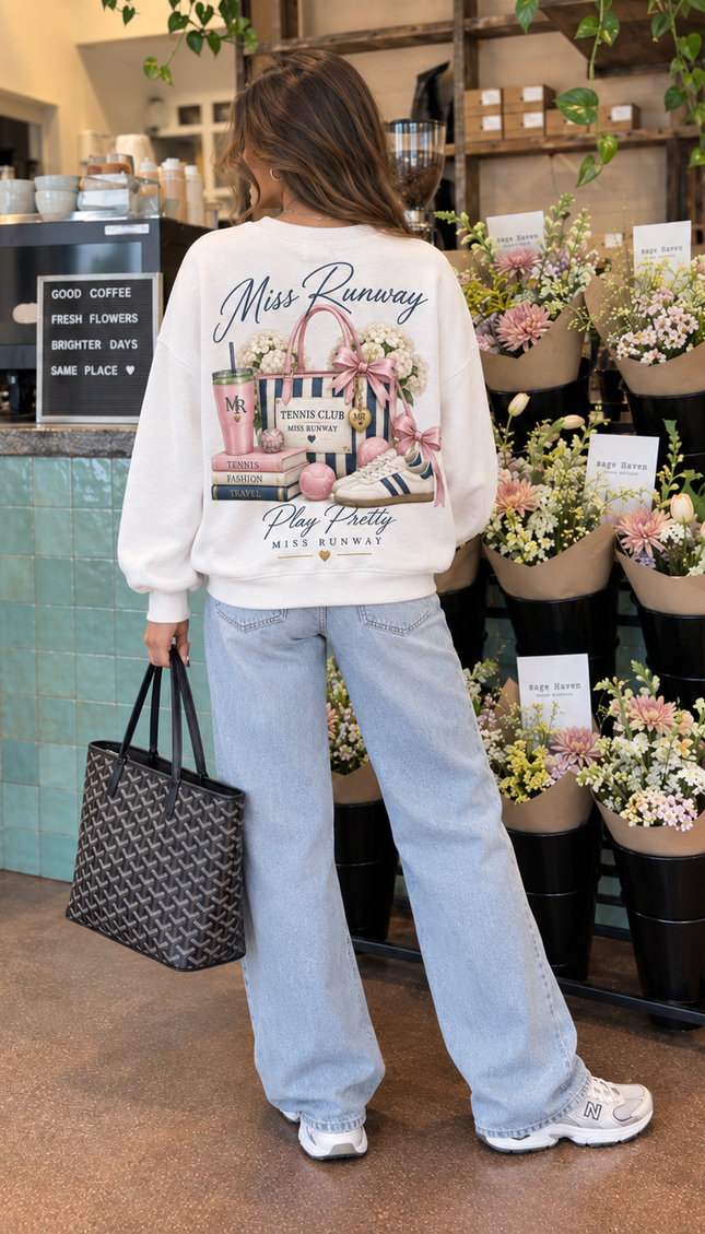 Back of the Miss Runway Sporting Club kids' sweatshirt in white with an illustrated handbag and Play Pretty script