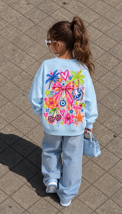 Back of the Sunshine & Smiles kids' sweatshirt in baby blue with a large pink bow surrounded by palm trees, a disco ball, an evil eye, cherries, flowers, a starfish and hearts in bright neon shades – Miss Runway
