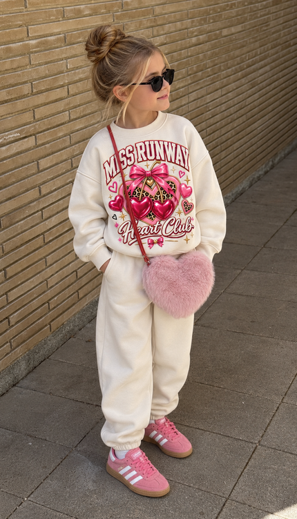 Front of the Heart Club kids' sweatshirt in cream with pink MISS RUNWAY lettering above shiny pink and red hearts with a leopard bow and Heart Club script – Miss Runway
