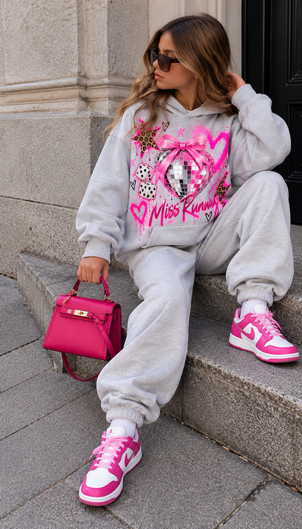 Girl wearing the Grey Kids Joggers with a grey printed Miss Runway hoodie by Miss Runway
